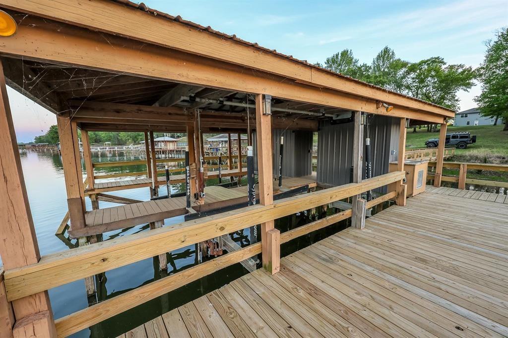 600 County Road 1503 Alba, TX 75410 - Photo 12 of 32 a view of a deck with wooden floor and furniture