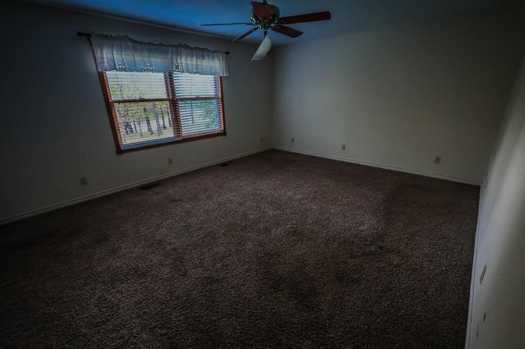 600 County Road 1503 Alba, TX 75410 - Photo 31 of 32 an empty room with windows and closet
