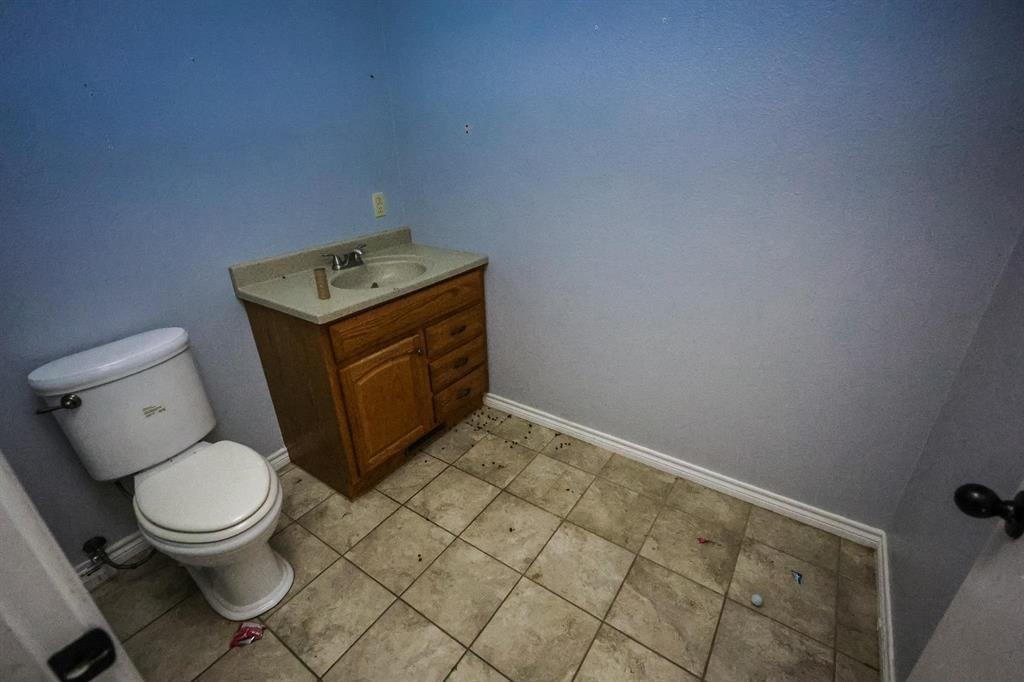 600 County Road 1503 Alba, TX 75410 - Photo 32 of 32 a bathroom with a toilet and a sink