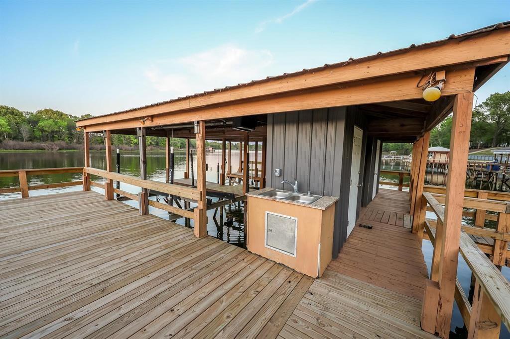 600 County Road 1503 Alba, TX 75410 - Photo 5 of 32 wooden floor with a barbeque