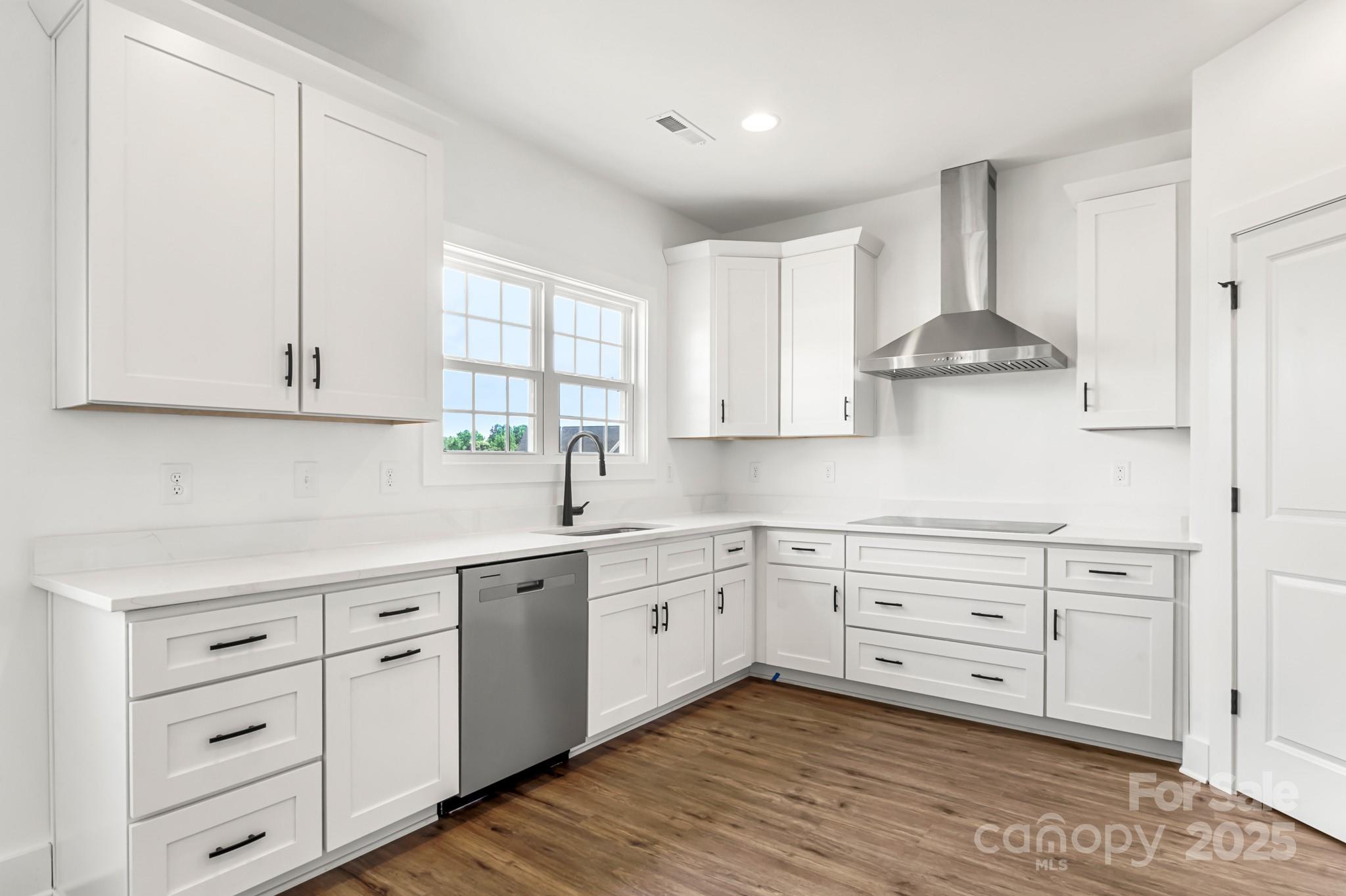 2025 Parks Road Salisbury, NC 28147 - Photo 11 of 47 a kitchen with stainless steel appliances white cabinets and a sink