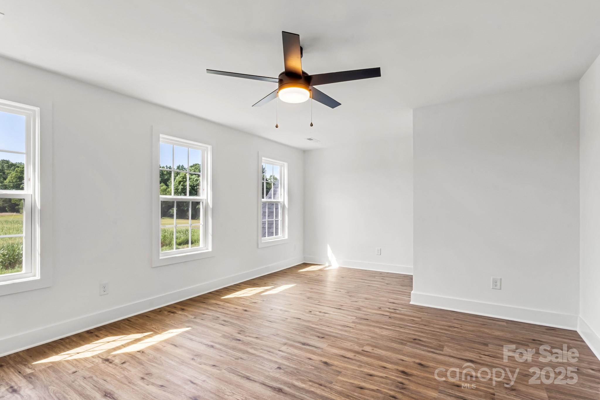 2025 Parks Road Salisbury, NC 28147 - Photo 32 of 47 a view of an empty room with wooden floor and a window