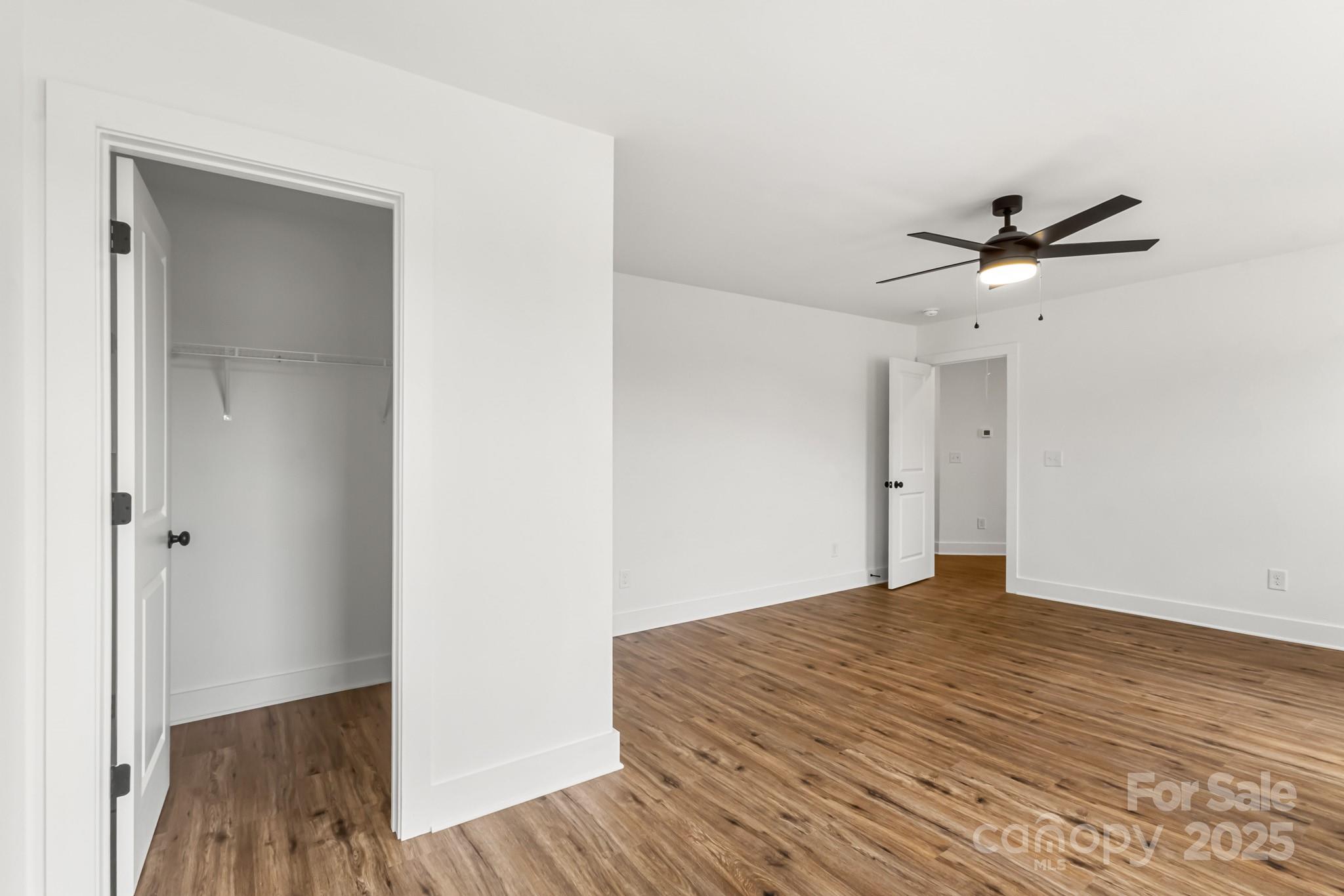 2025 Parks Road Salisbury, NC 28147 - Photo 34 of 47 a view of a room with wooden floor and a ceiling fan