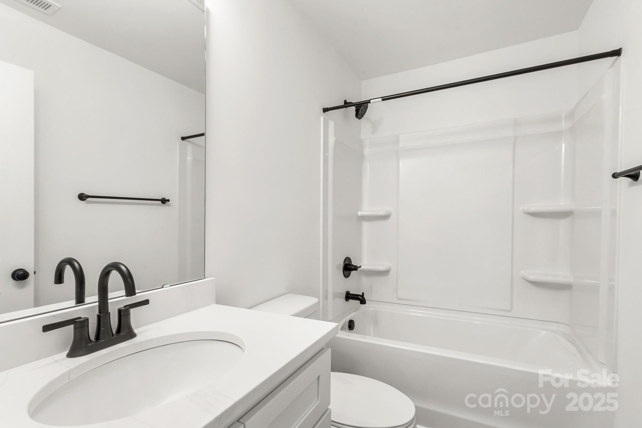 2025 Parks Road Salisbury, NC 28147 - Photo 35 of 47 a bathroom with a sink toilet and shower