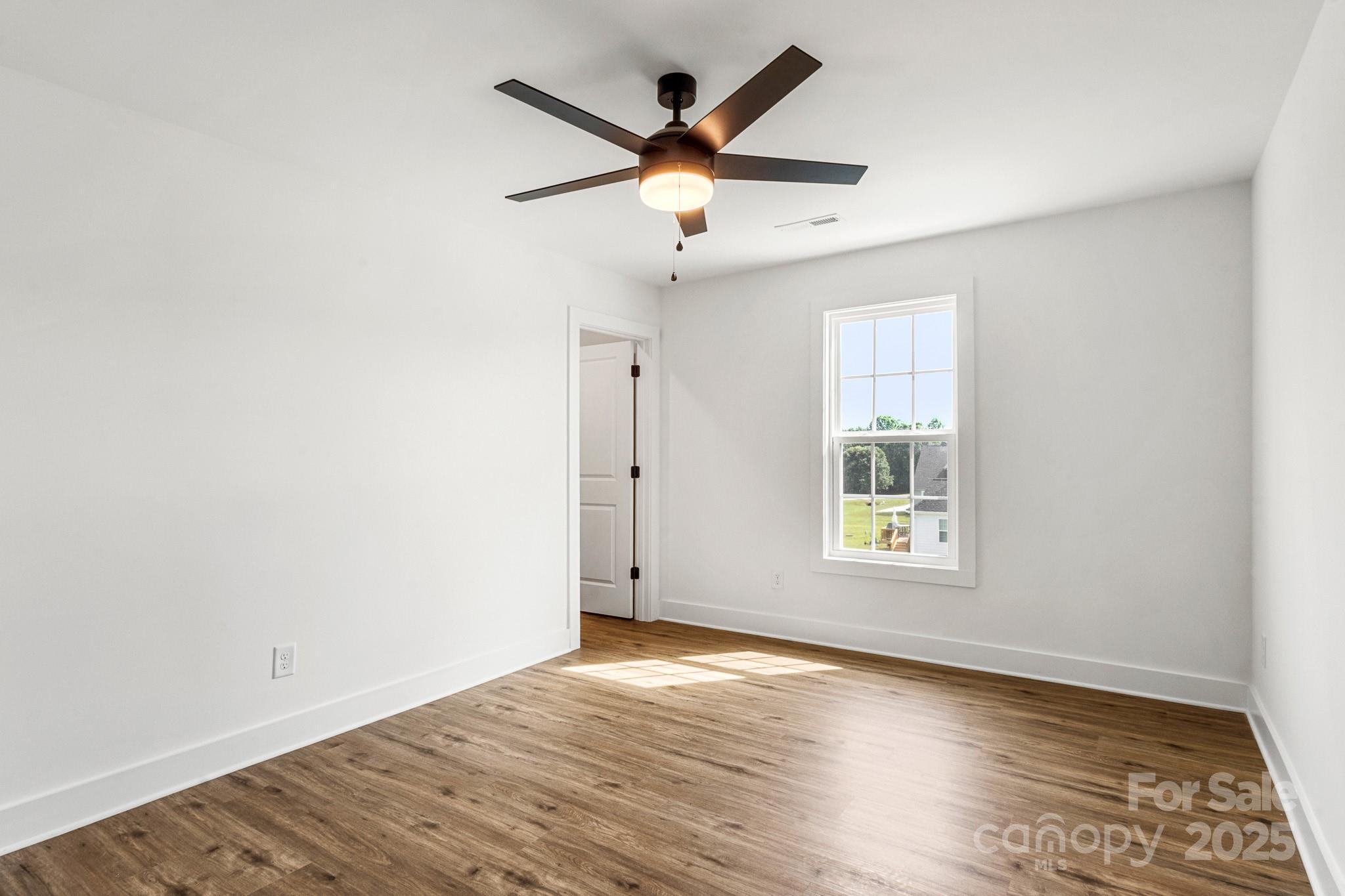 2025 Parks Road Salisbury, NC 28147 - Photo 36 of 47 wooden floor in an empty room with a window