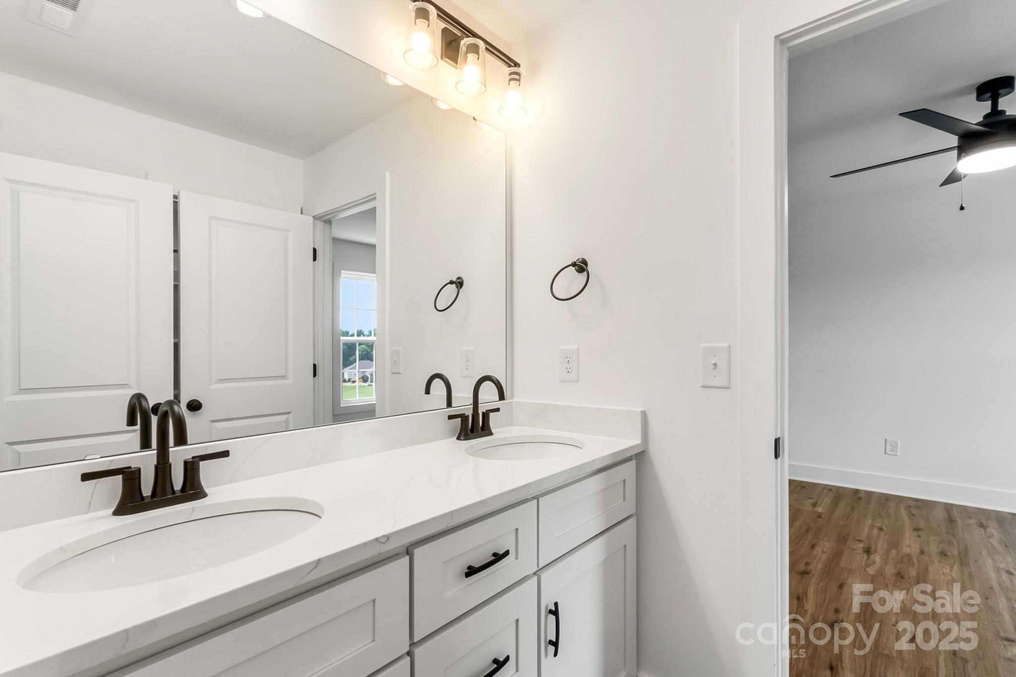 2025 Parks Road Salisbury, NC 28147 - Photo 40 of 47 a bathroom with a sink and a mirror