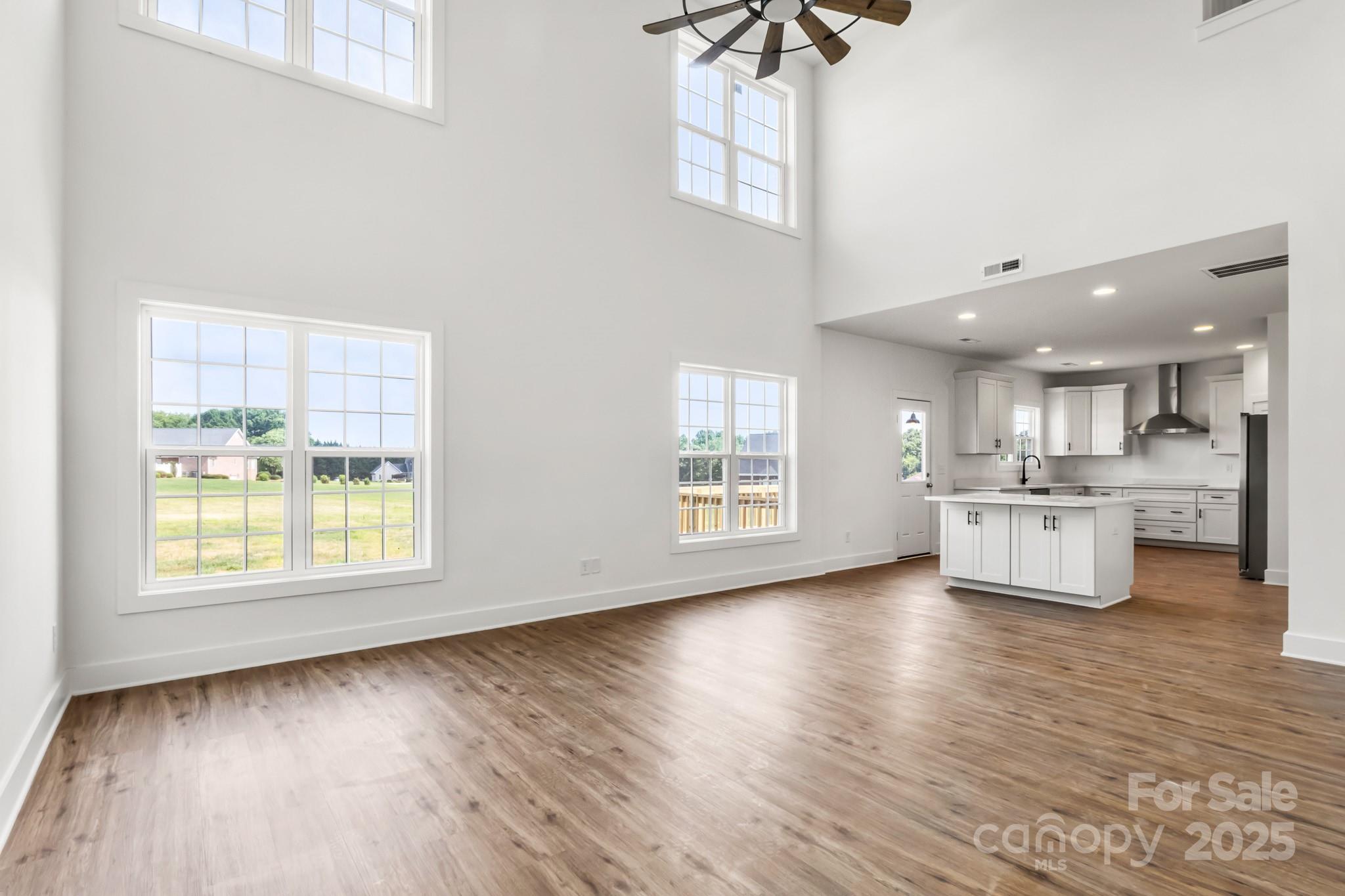 2025 Parks Road Salisbury, NC 28147 - Photo 6 of 47 a view of kitchen and hall with wooden floor
