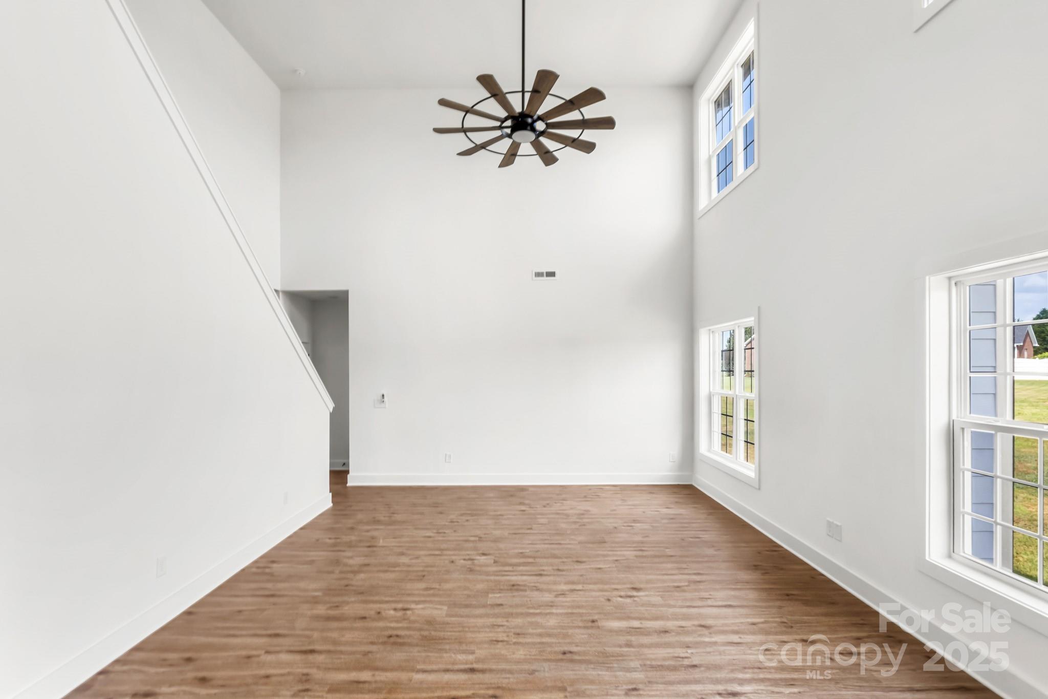 2025 Parks Road Salisbury, NC 28147 - Photo 8 of 47 a view of empty room with window and wooden floor