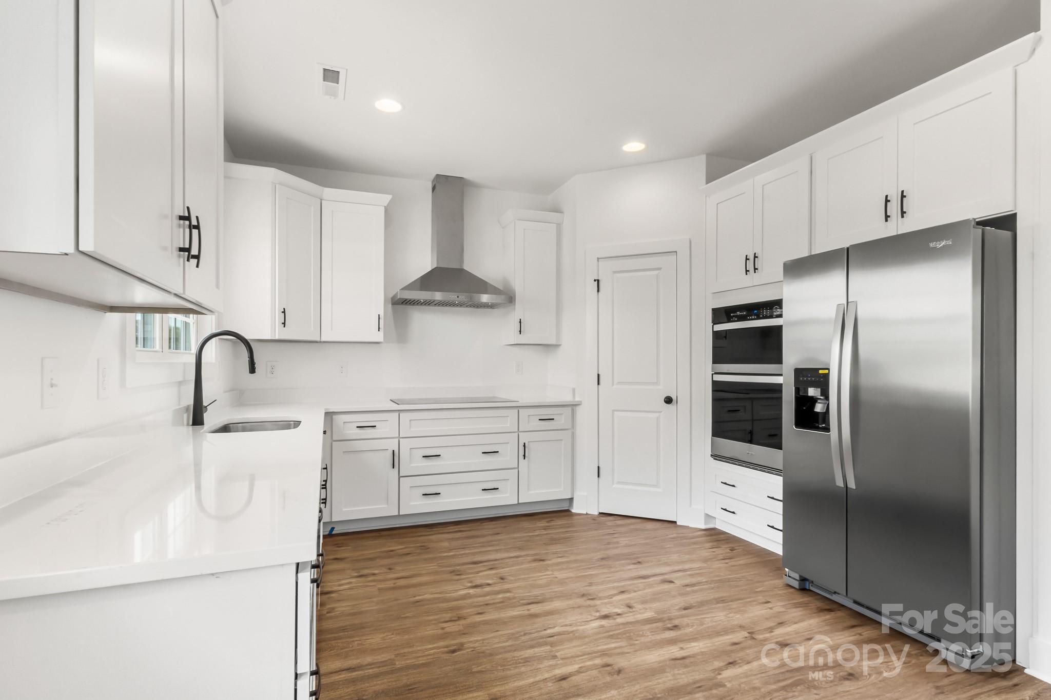 2025 Parks Road Salisbury, NC 28147 - Photo 10 of 47 a kitchen with stainless steel appliances a refrigerator sink and cabinets