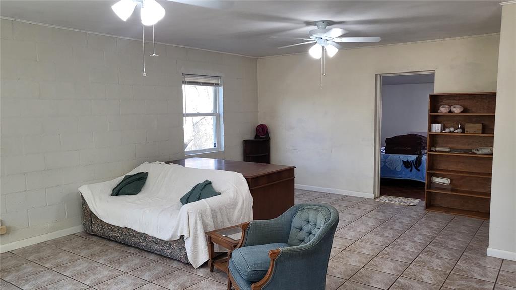 25208 Old Ferry Road Spicewood, TX 78669 - Photo 15 of 18 a bedroom with furniture and a window