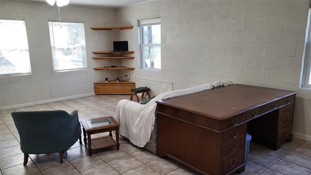 25208 Old Ferry Road Spicewood, TX 78669 - Photo 16 of 18 a kitchen that has a sink and a chair in it