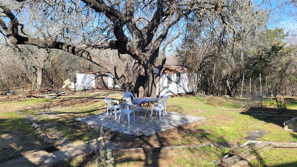 25208 Old Ferry Road Spicewood, TX 78669 - Photo 4 of 18 a swimming pool with wooden fence