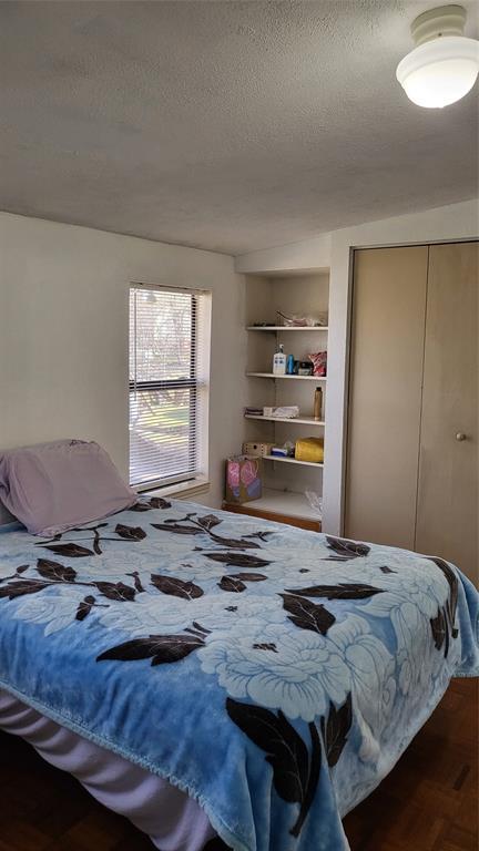 25208 Old Ferry Road Spicewood, TX 78669 - Photo 8 of 18 a bedroom with a bed and a window