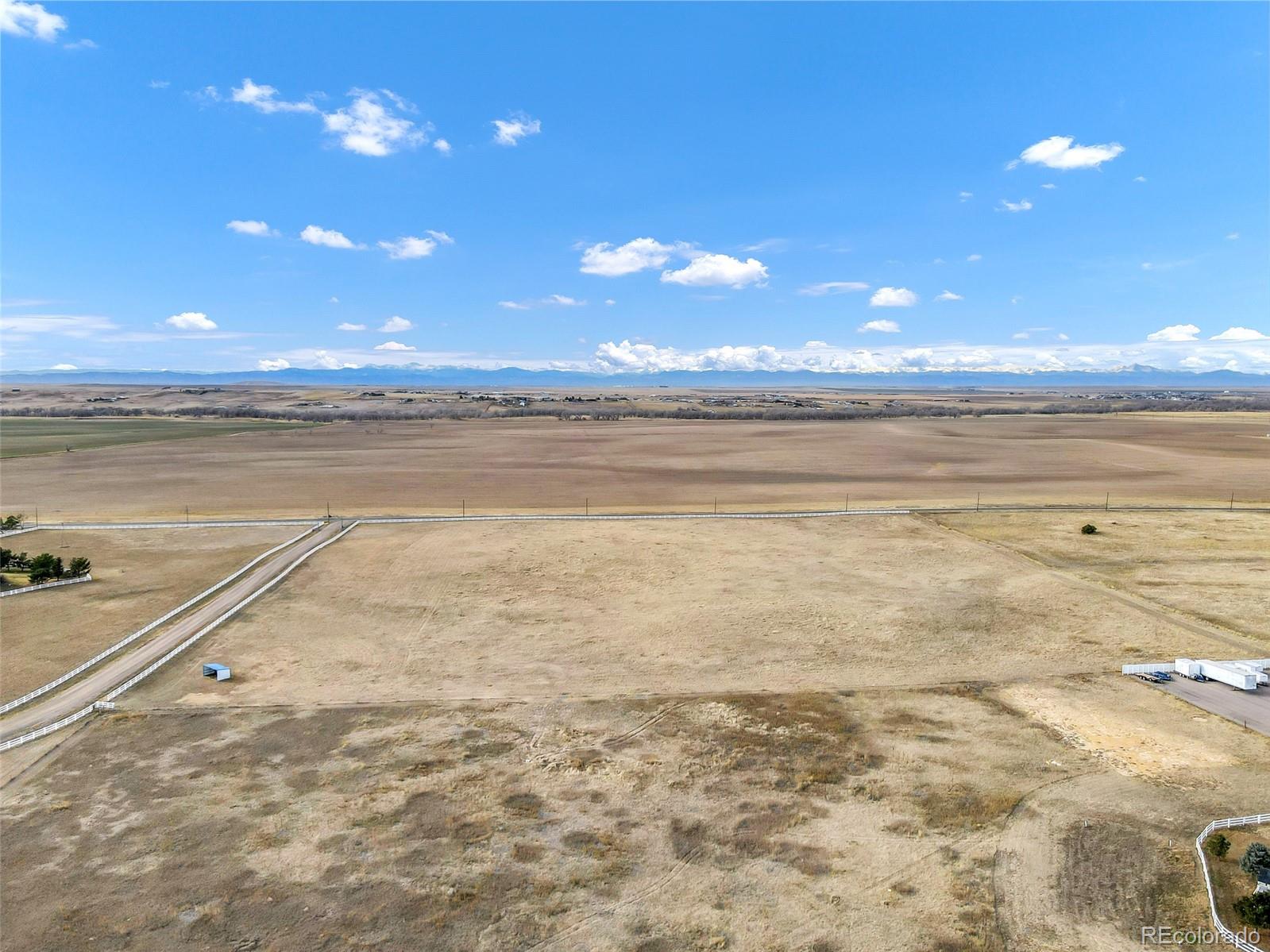 0 South Manila Road Bennett, CO 80102 - Photo 3 of 8 a view of an ocean and a yard