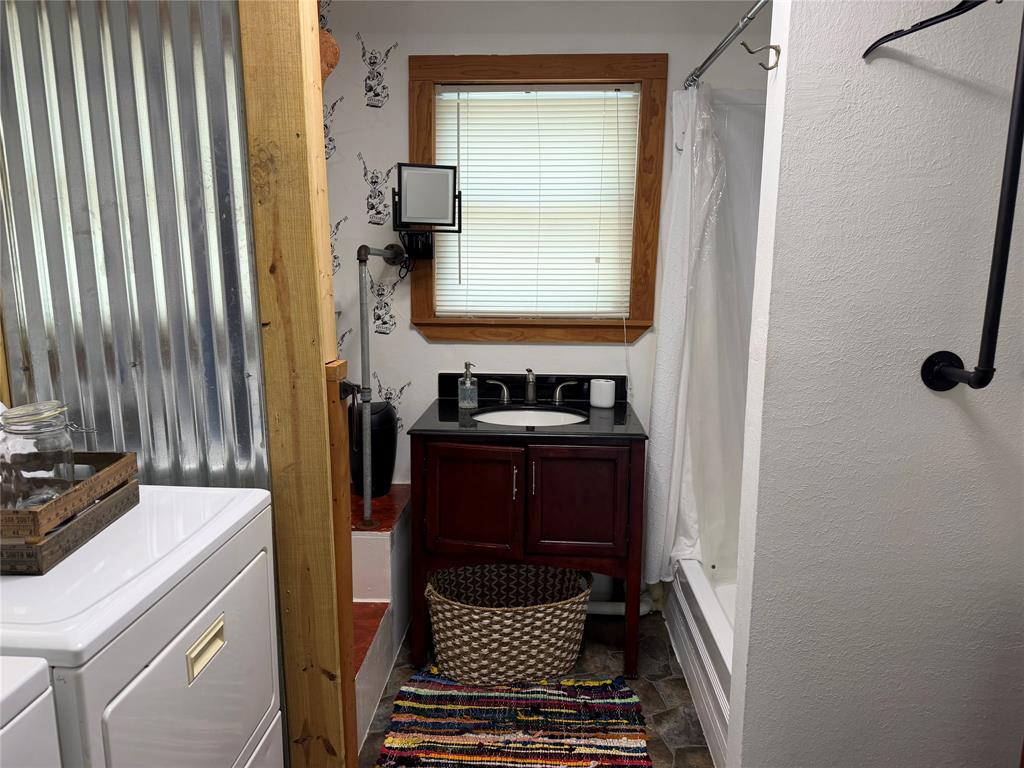 111 Apache Trail Whitney, TX 76692 - Photo 24 of 40 a bathroom with a sink and a mirror