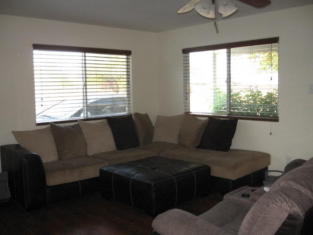 13471 Gilbert Street Edwards, CA 93523 - Photo 3 of 16 a living room with furniture and a window