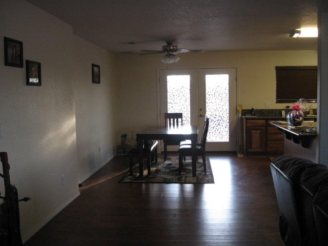 13471 Gilbert Street Edwards, CA 93523 - Photo 4 of 16 a view of a livingroom with furniture hardwood floor and a flat screen tv