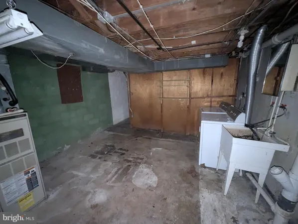 a view of a room with table and chairs