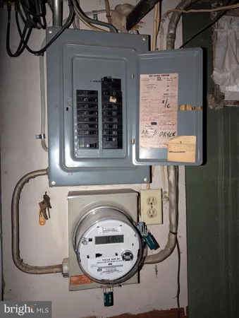 a view of bathroom with a sink and mirror