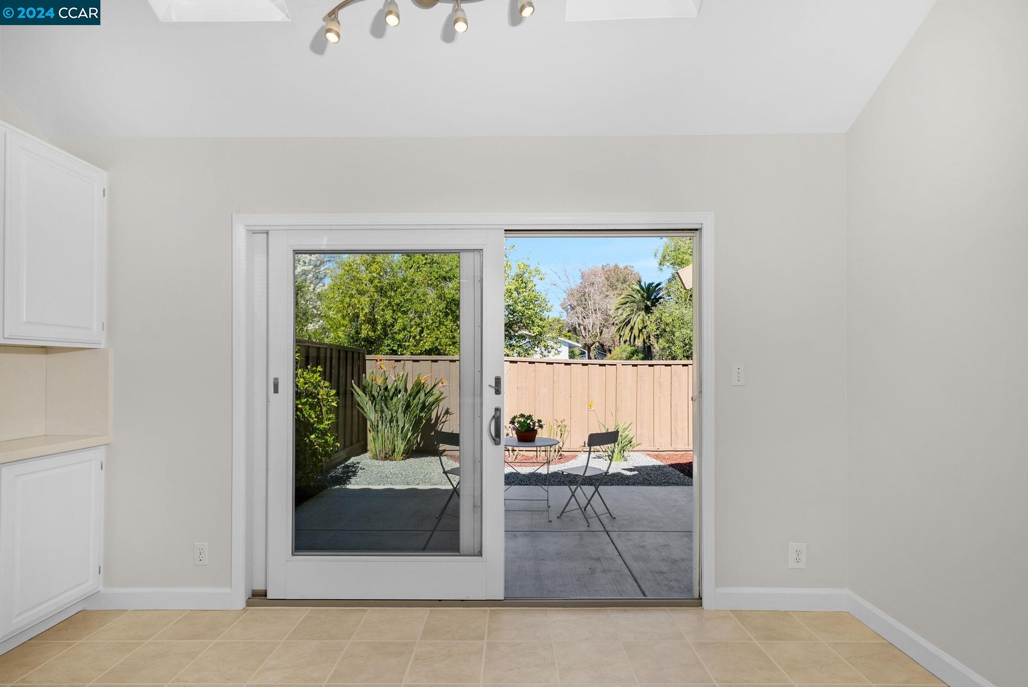 646 Preakness Drive Walnut Creek, CA 94597 - Photo 11 of 26 an empty room with wooden floor and outdoor view