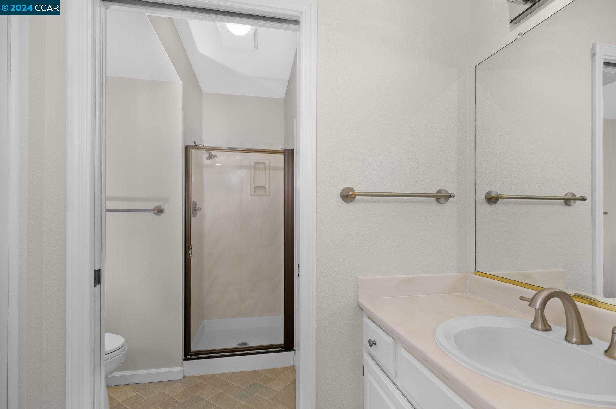 646 Preakness Drive Walnut Creek, CA 94597 - Photo 16 of 26 a bathroom with a sink and mirror