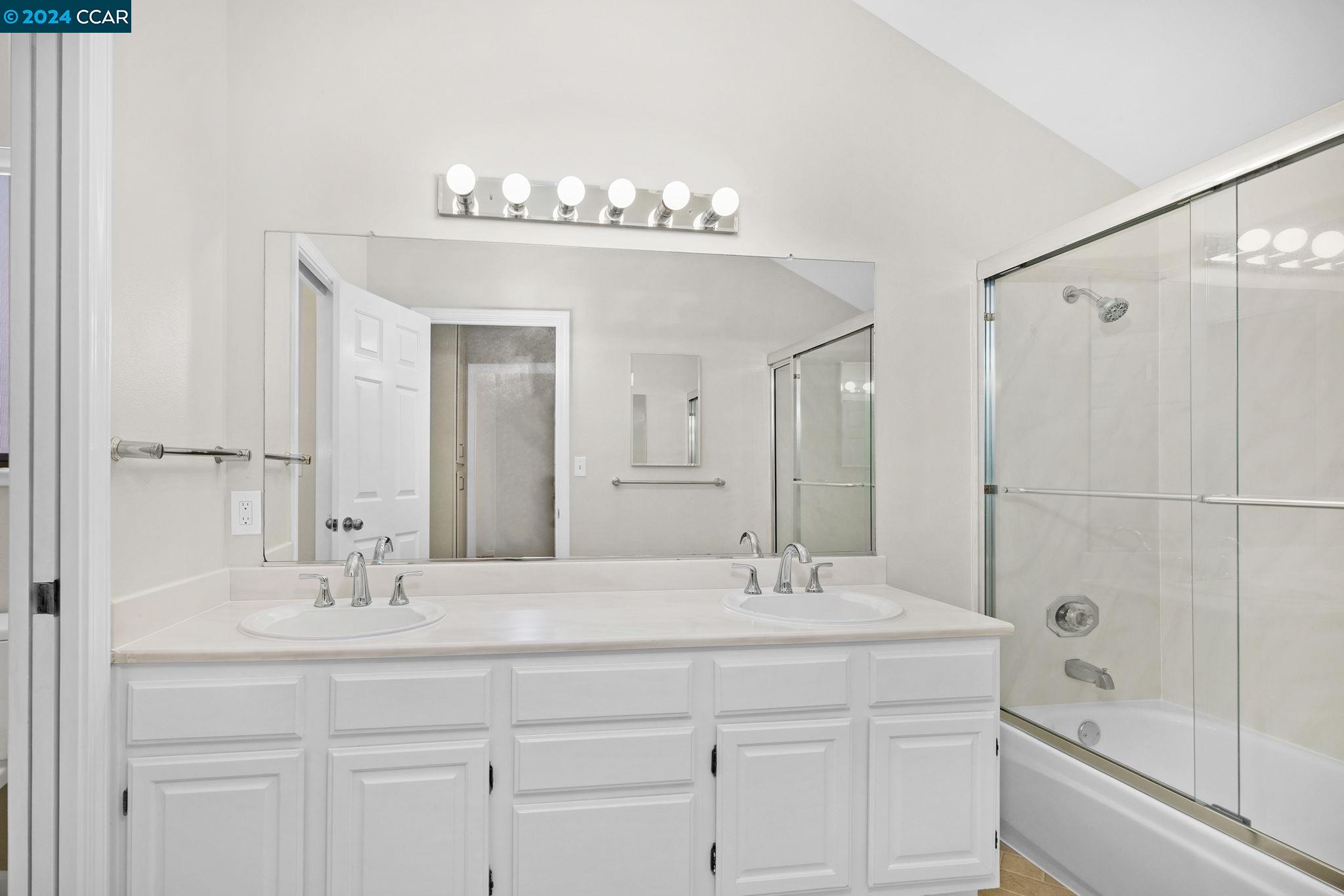 646 Preakness Drive Walnut Creek, CA 94597 - Photo 21 of 26 a bathroom with a sink double vanity and a bathtub