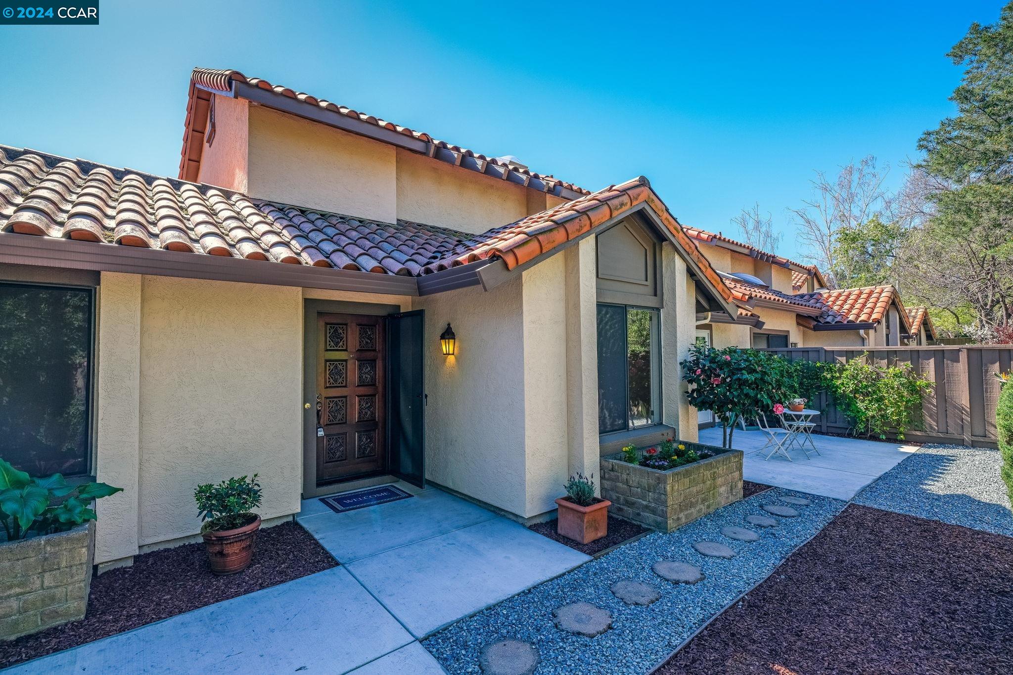 646 Preakness Drive Walnut Creek, CA 94597 - Photo 3 of 26 a front view of a house with garden