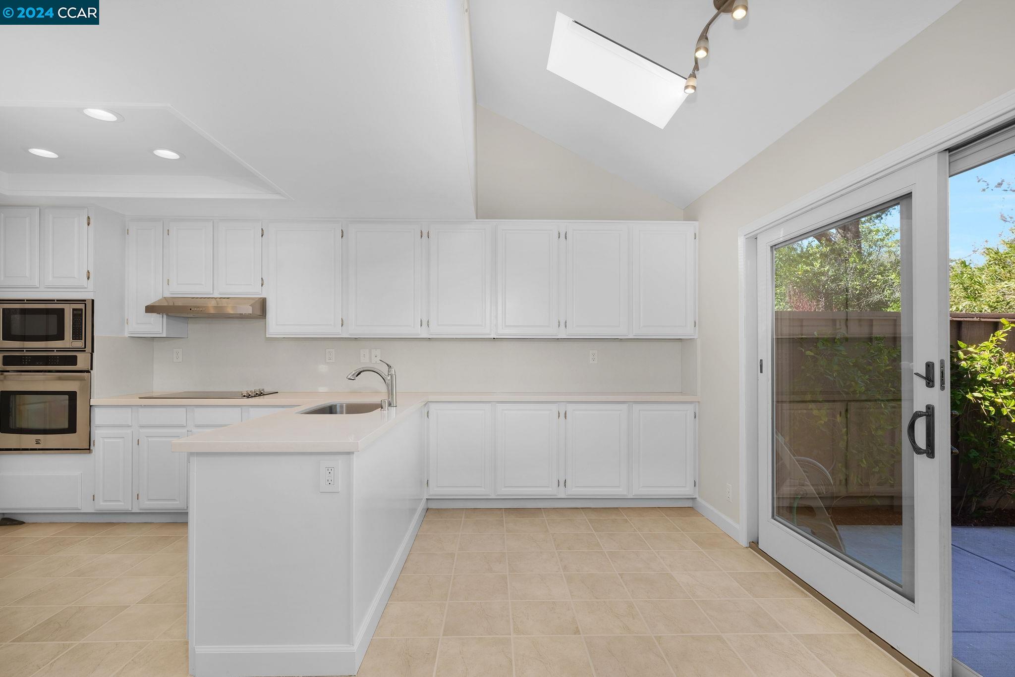 646 Preakness Drive Walnut Creek, CA 94597 - Photo 7 of 26 a kitchen with a sink a stove and cabinets