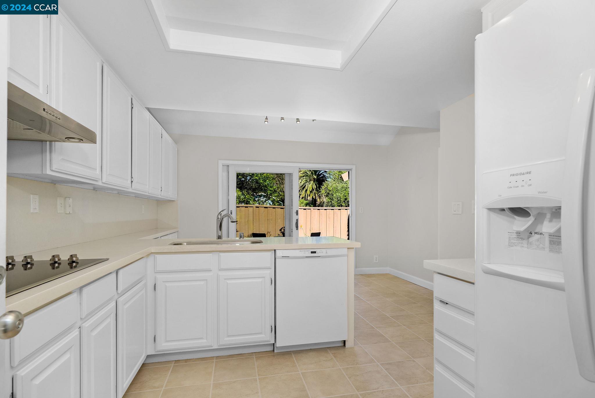 646 Preakness Drive Walnut Creek, CA 94597 - Photo 10 of 26 a kitchen with white cabinets