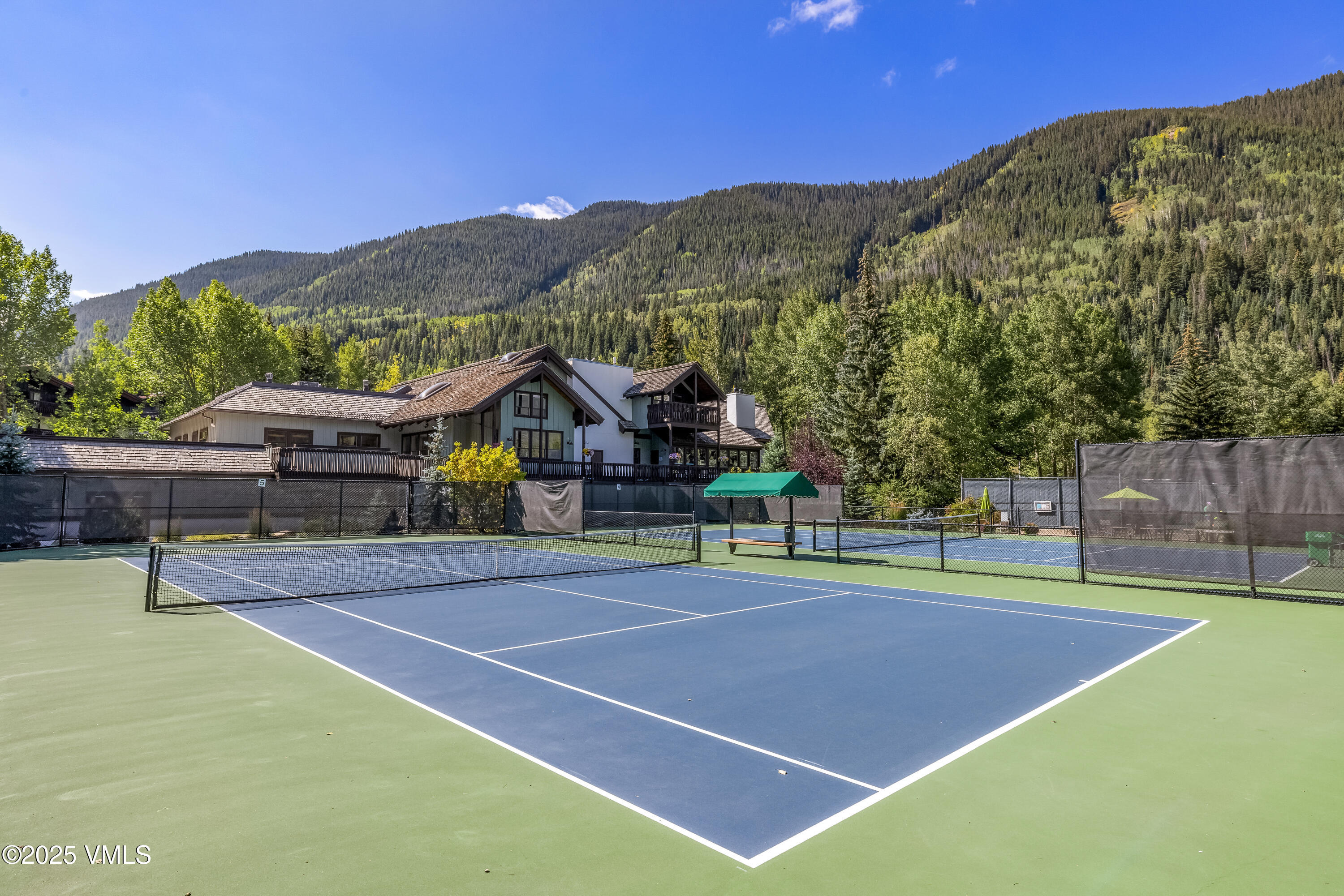 4630 Vail Racquet Club Drive, Unit 15 Vail, CO 81657 - Photo 16 of 20 a view of an outdoor space and tennis court