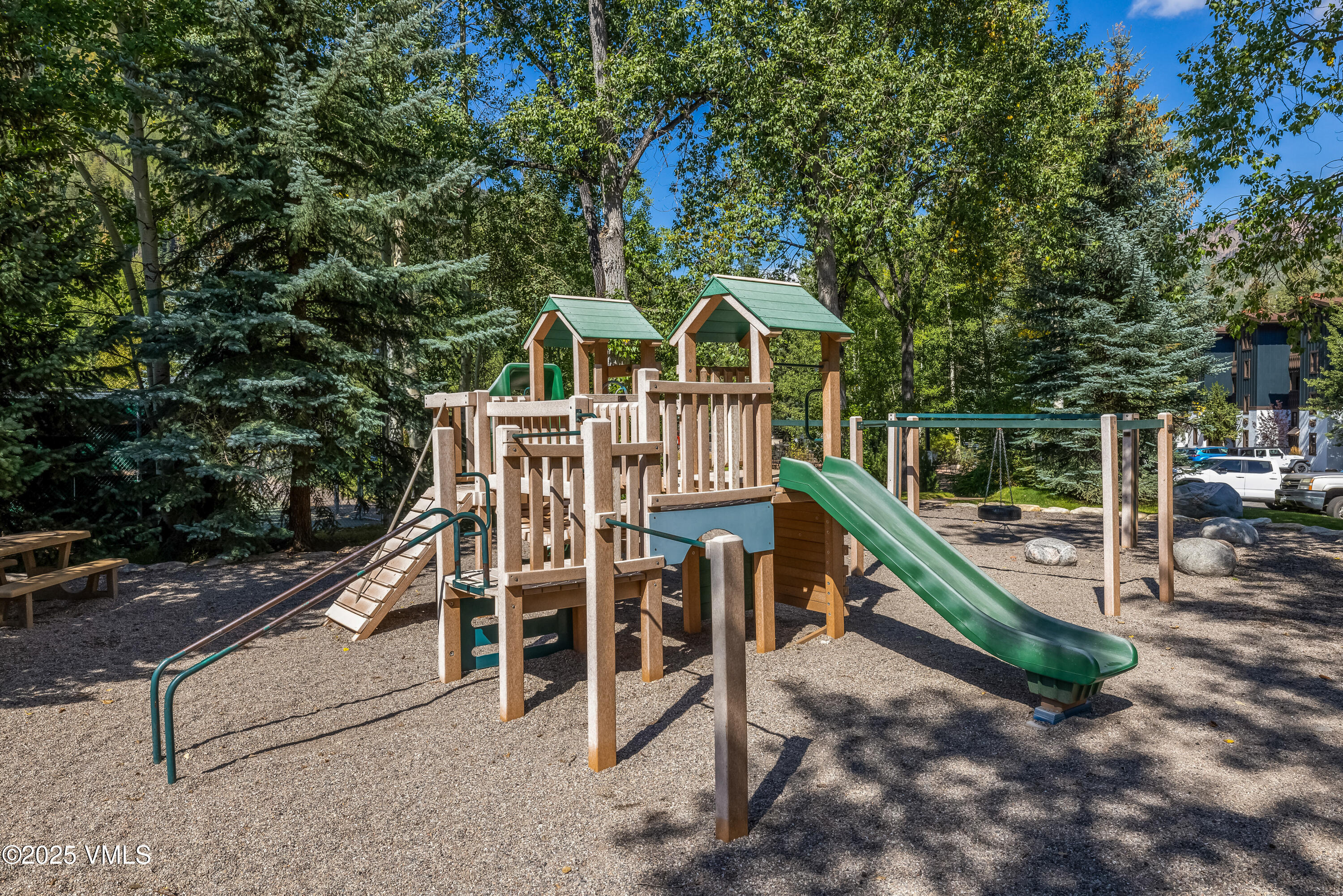 4630 Vail Racquet Club Drive, Unit 15 Vail, CO 81657 - Photo 19 of 20 a view of a chairs and tables in the backyard