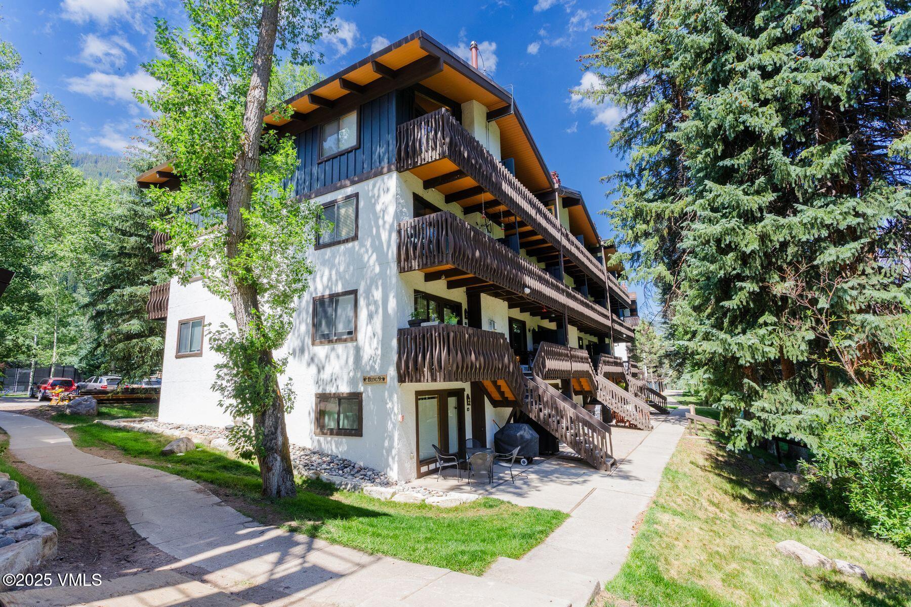 4630 Vail Racquet Club Drive, Unit 15 Vail, CO 81657 - Photo 10 of 20 a front view of a house with garden