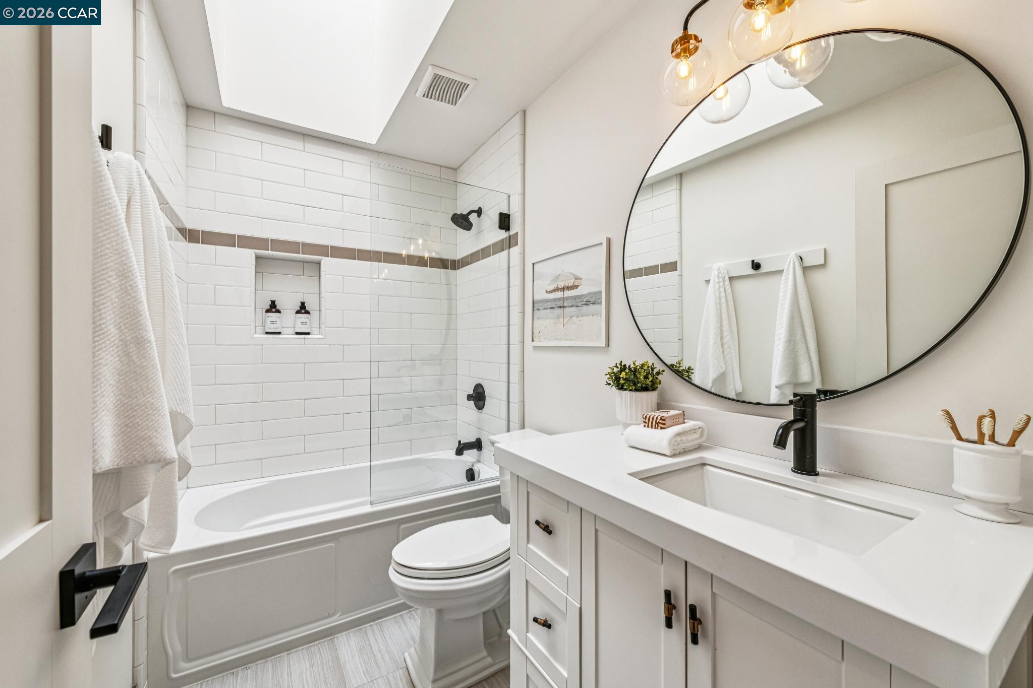 2941 Roundhill Road Alamo, CA 94507 - Photo 44 of 83 a bathroom with a sink a toilet and a mirror