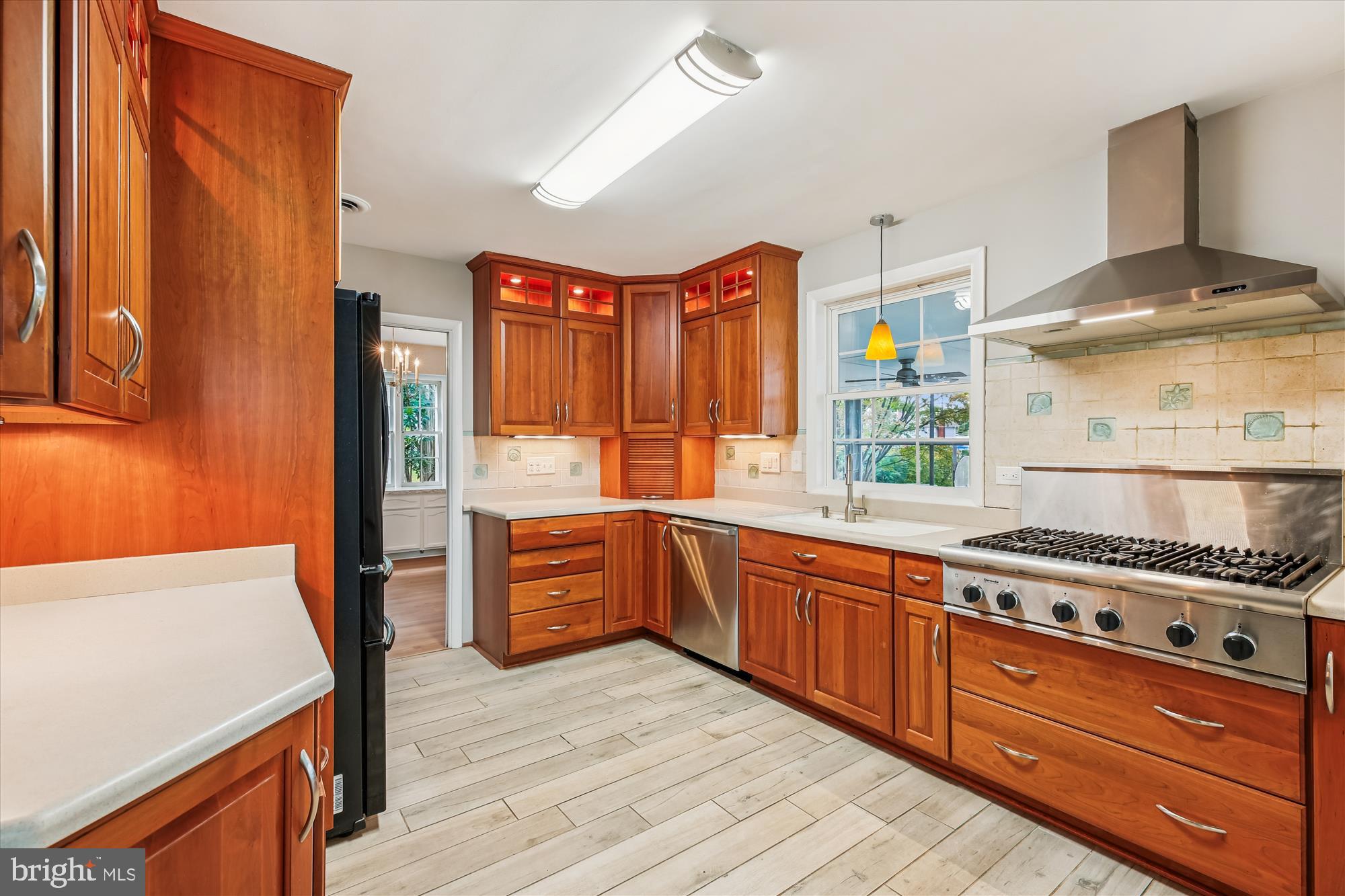 11803 Eden Road Silver Spring, MD 20904 - Photo 11 of 45 a kitchen with stainless steel appliances granite countertop a stove a sink and a refrigerator