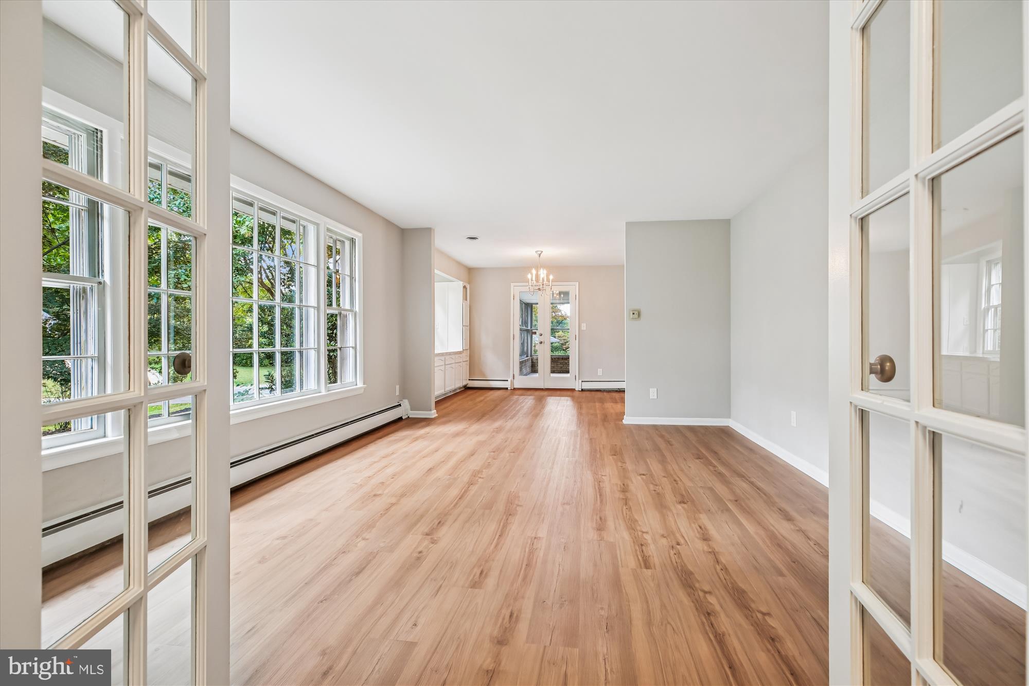 11803 Eden Road Silver Spring, MD 20904 - Photo 16 of 45 a view of an empty room with wooden floor and a window