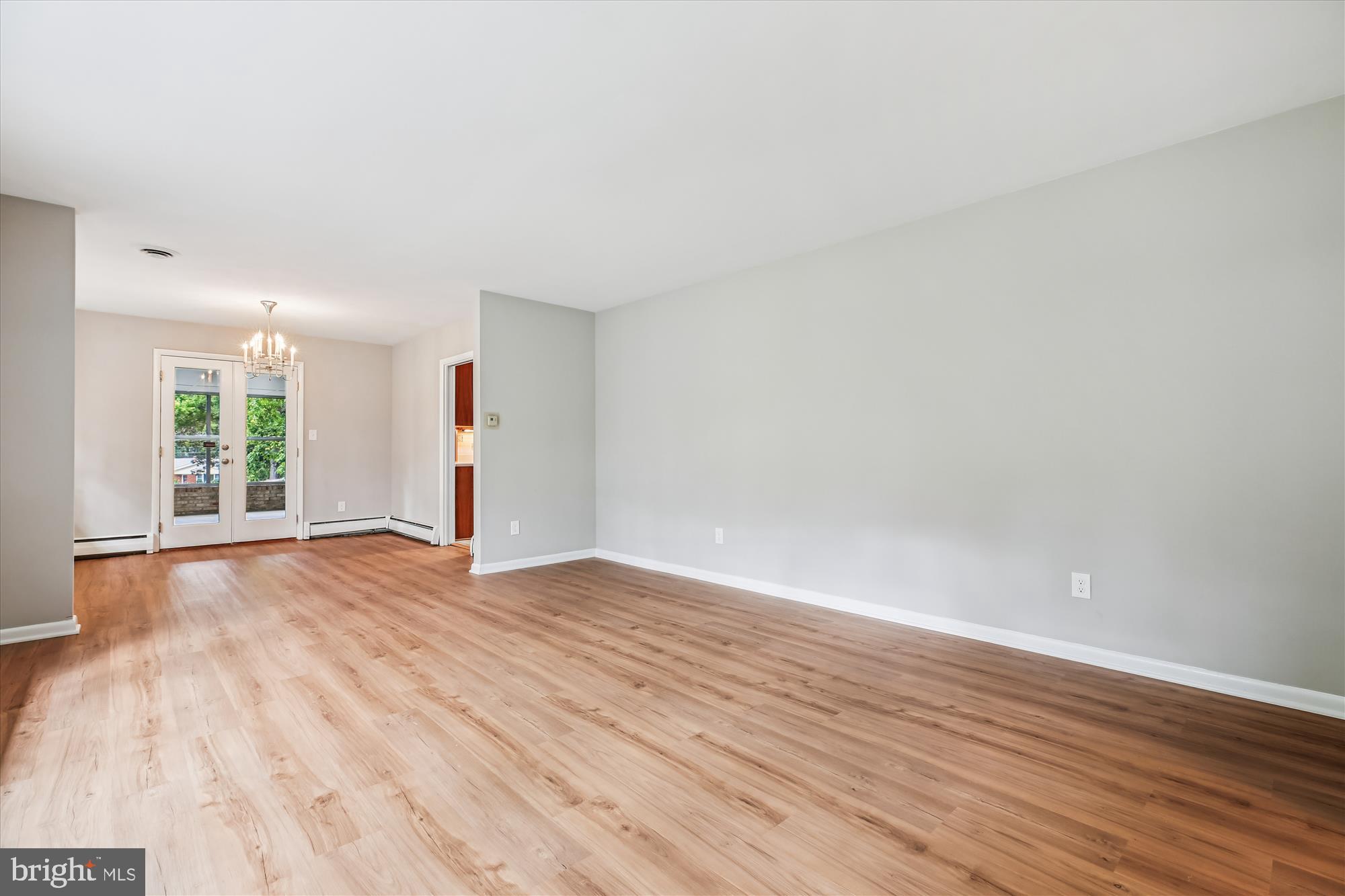 11803 Eden Road Silver Spring, MD 20904 - Photo 18 of 45 a view of empty room with wooden floor and fan