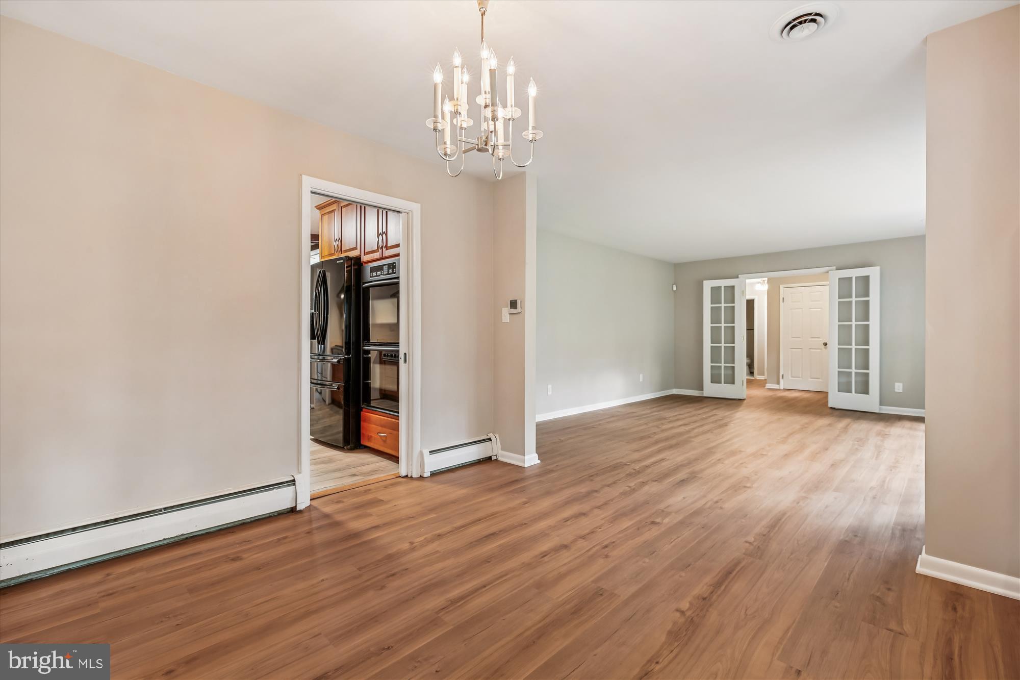11803 Eden Road Silver Spring, MD 20904 - Photo 20 of 45 wooden floor in an empty room with a window