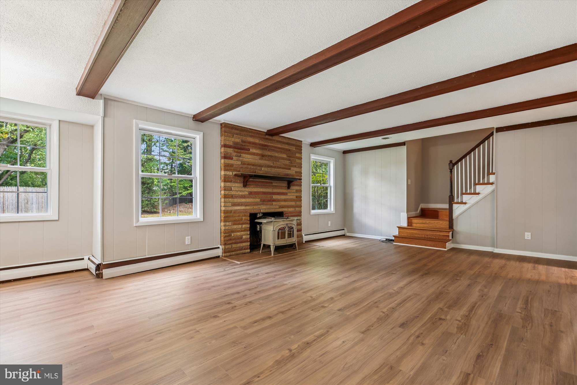 11803 Eden Road Silver Spring, MD 20904 - Photo 22 of 45 an empty room with wooden floor and a window
