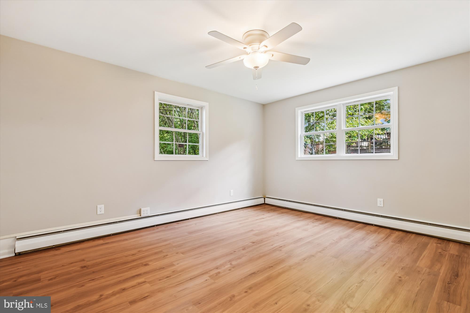 11803 Eden Road Silver Spring, MD 20904 - Photo 25 of 45 a view of an empty room with wooden floor and a window