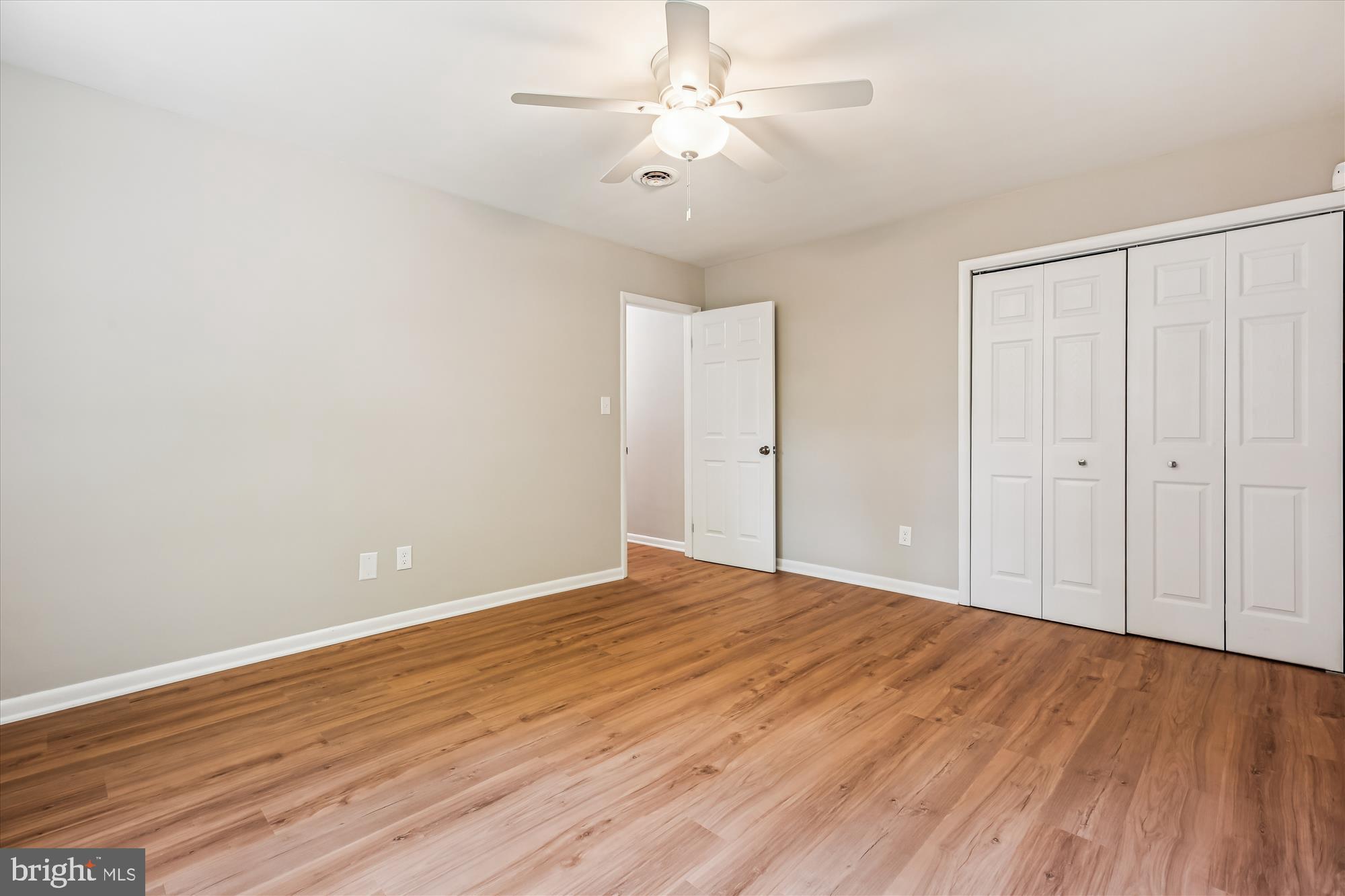 11803 Eden Road Silver Spring, MD 20904 - Photo 27 of 45 a view of an empty room with wooden floor