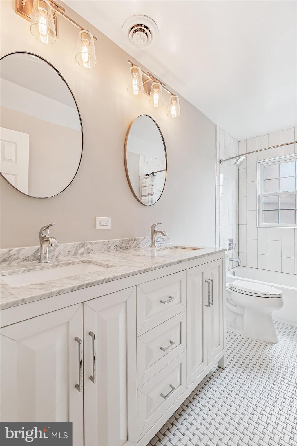 11803 Eden Road Silver Spring, MD 20904 - Photo 29 of 45 a bathroom with a granite countertop double vanity sink and a mirror
