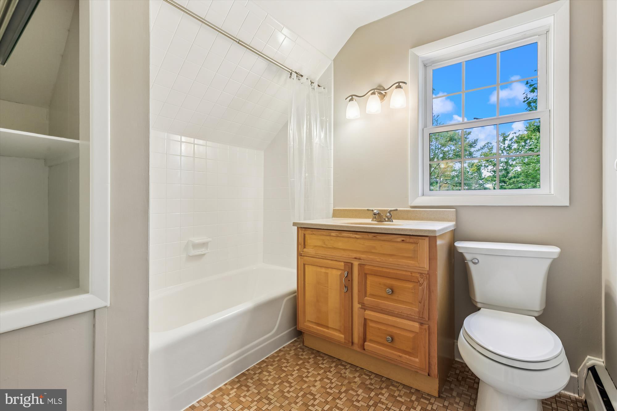 11803 Eden Road Silver Spring, MD 20904 - Photo 34 of 45 a bathroom with a granite countertop toilet a sink and a bathtub