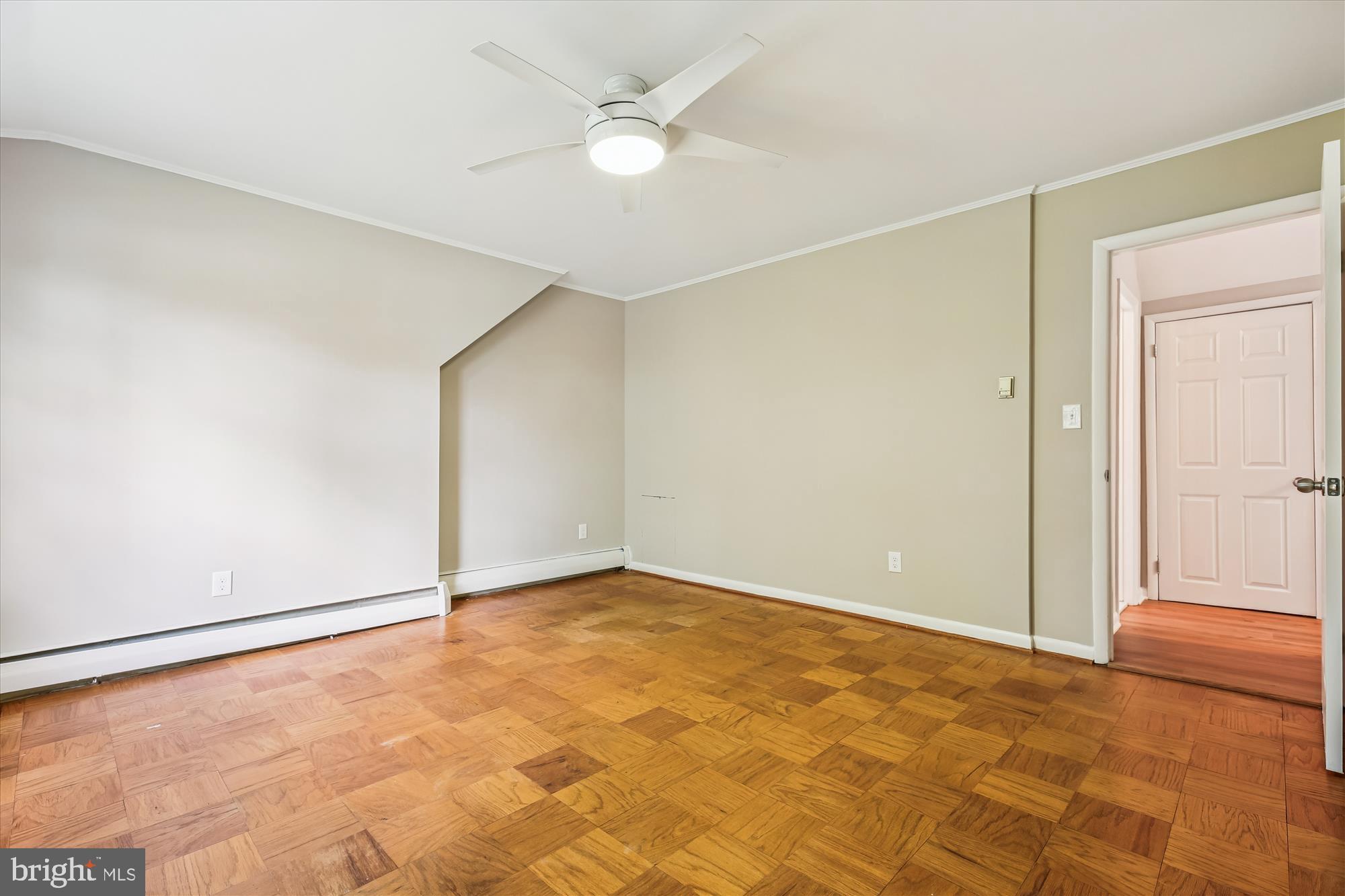 11803 Eden Road Silver Spring, MD 20904 - Photo 37 of 45 an empty room with a ceiling fan and carpet