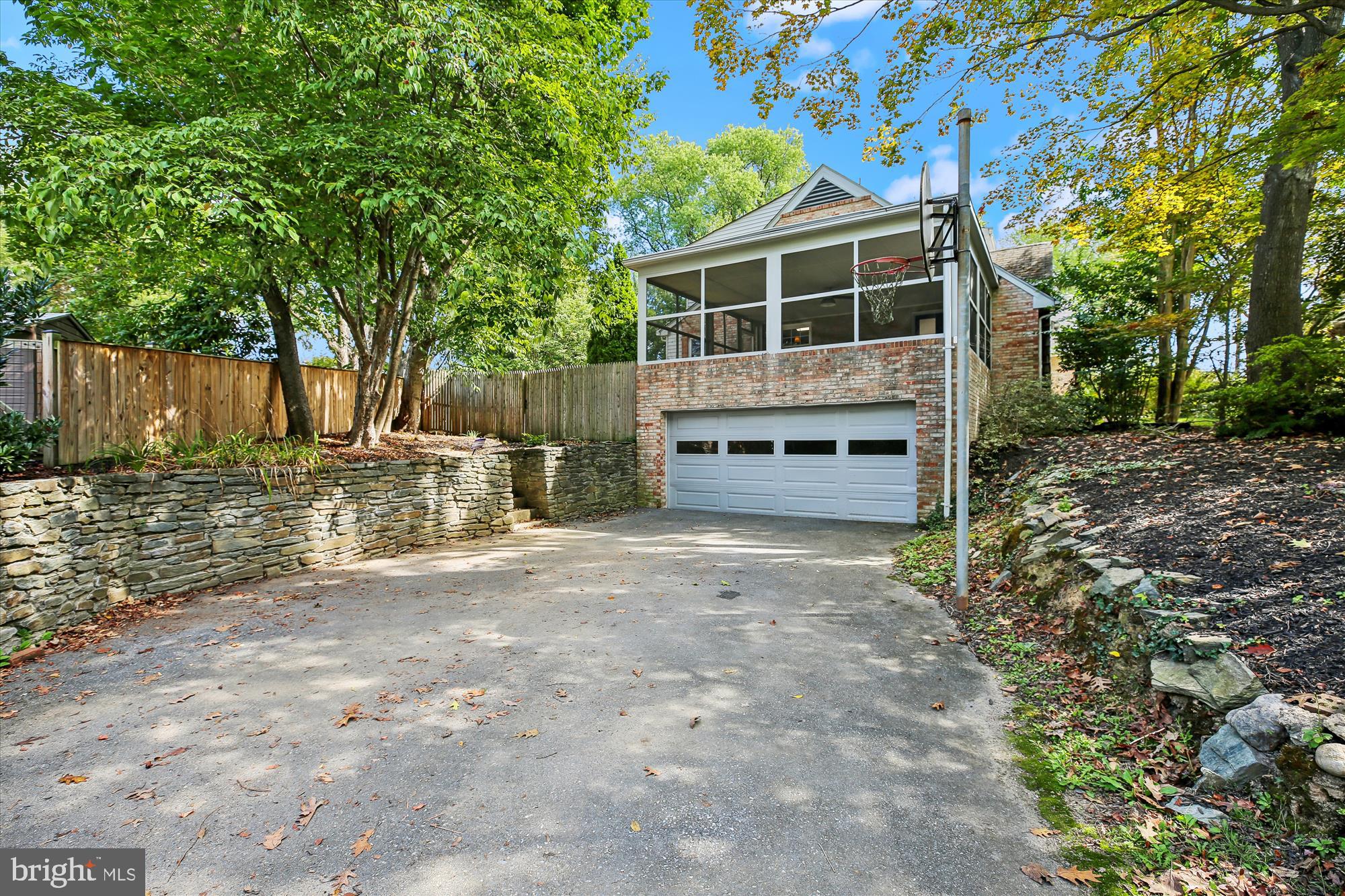 11803 Eden Road Silver Spring, MD 20904 - Photo 5 of 45 a backyard of a house with wooden fence and large trees
