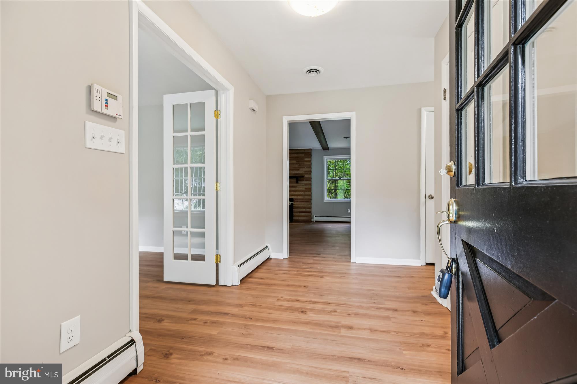 11803 Eden Road Silver Spring, MD 20904 - Photo 10 of 45 a view of a hallway with wooden floor and a living room