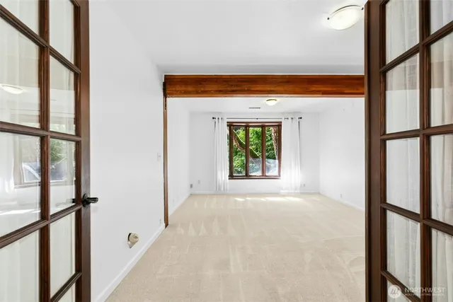 a view of an empty room with a window