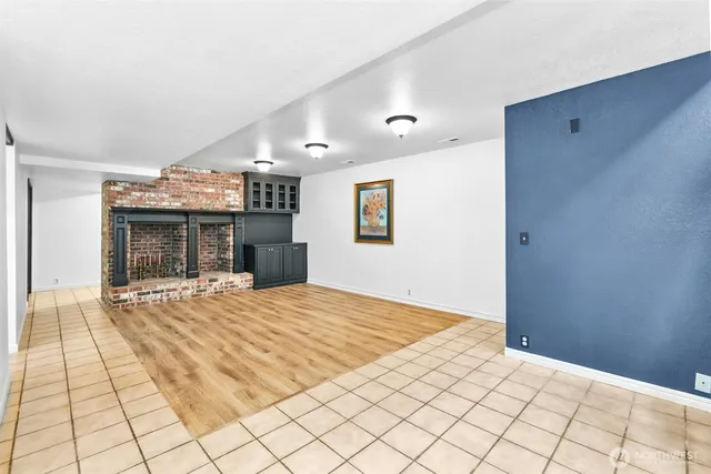 a view of a room with shelves on the wall