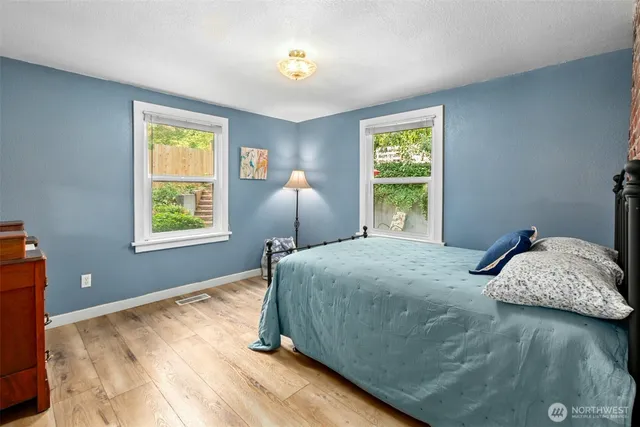 a bedroom with a bed and window