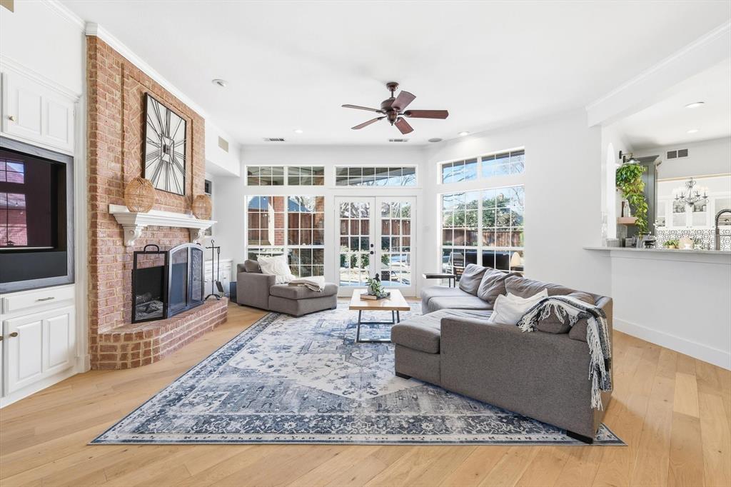 117 Sand Point Court Coppell, TX 75019 - Photo 12 of 40 a living room with fireplace furniture and a rug