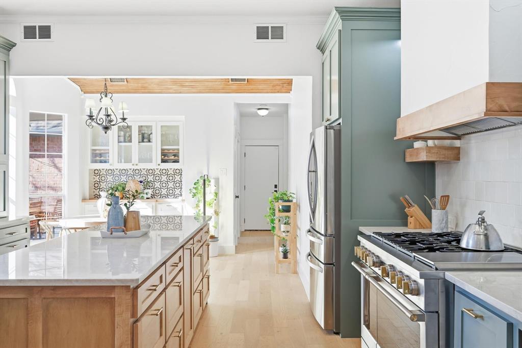 117 Sand Point Court Coppell, TX 75019 - Photo 16 of 40 a kitchen with stainless steel appliances granite countertop a sink and a stove